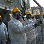 FEMA workers pause while cleaning homes on Saturday